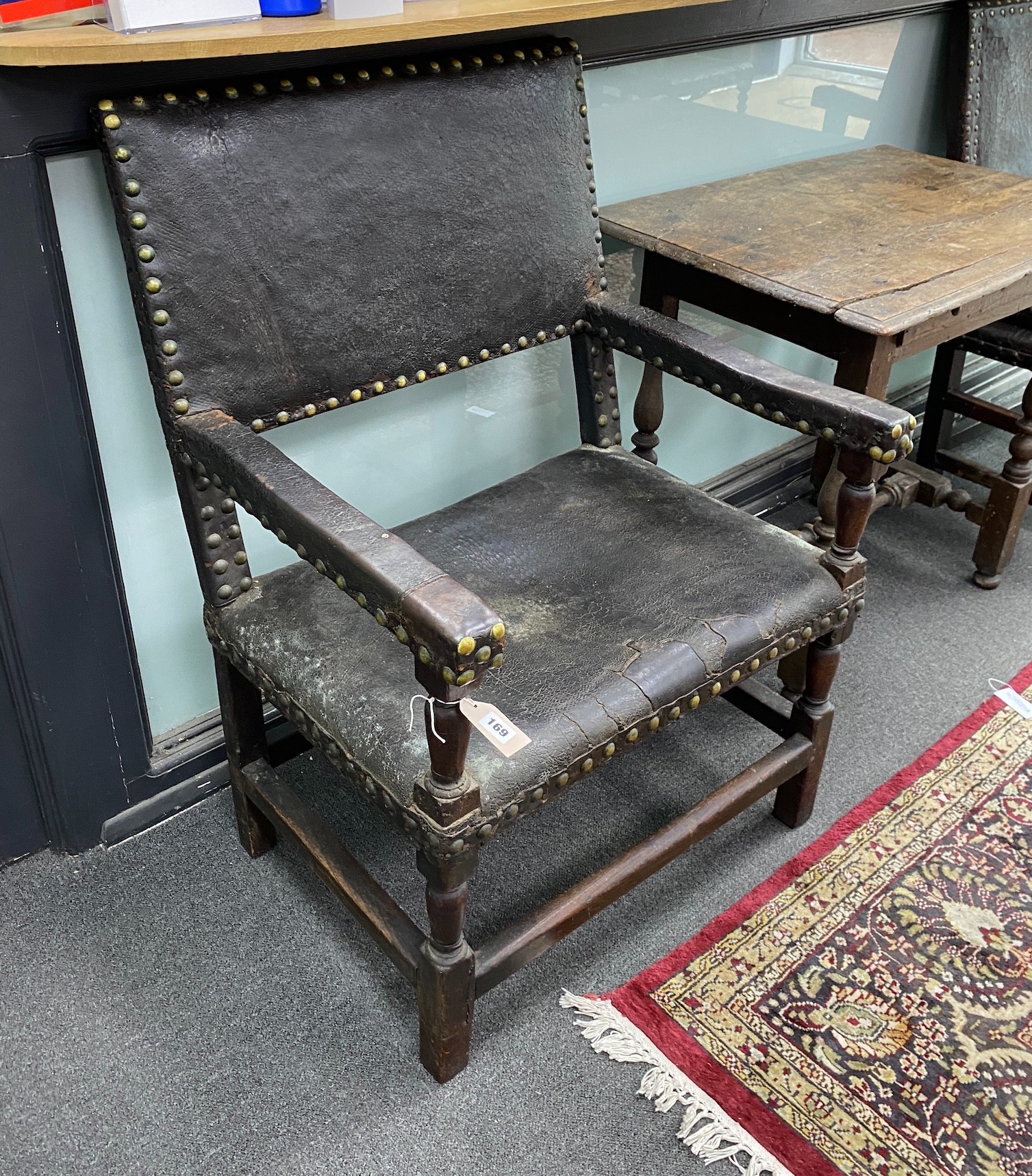 A near pair of 18th century oak and leather dining chairs, larger 69cm, depth 64cm, height 101cm